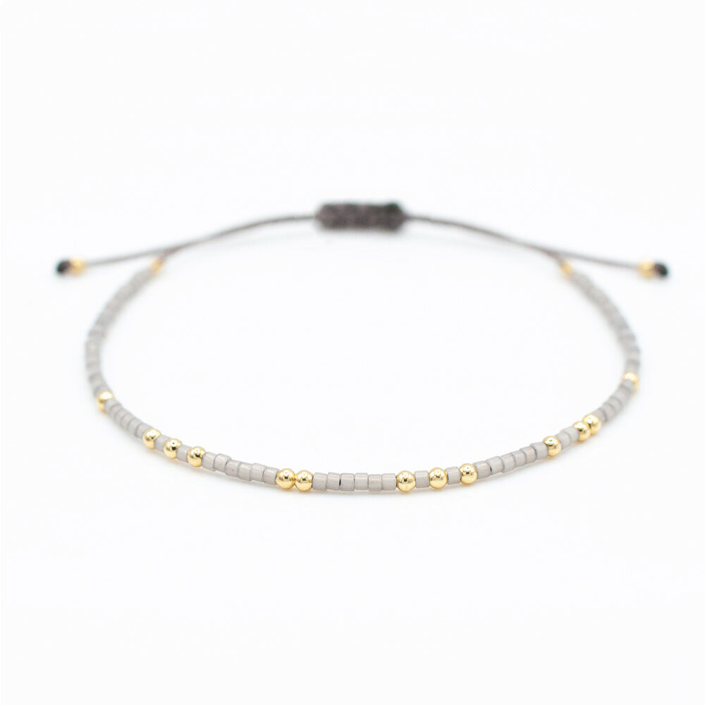 Armband mit grauen Miyuki Perlen und Goldperlen